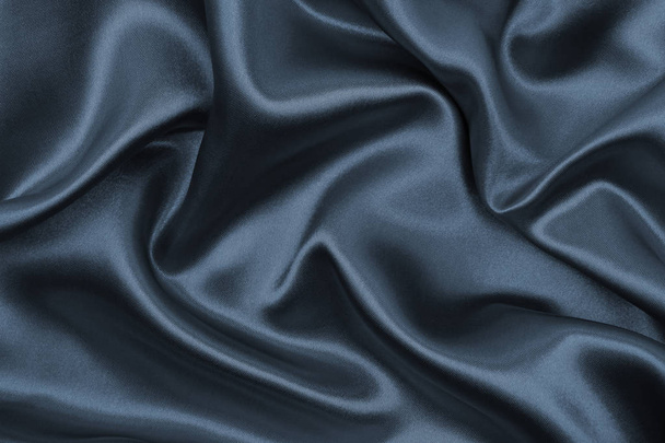 Smooth elegant dark grey silk or satin texture as abstract backg - Photo, Image