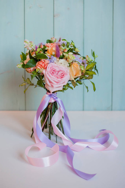 beautiful lush bouquet with roses, turquoise background, gift - Φωτογραφία, εικόνα
