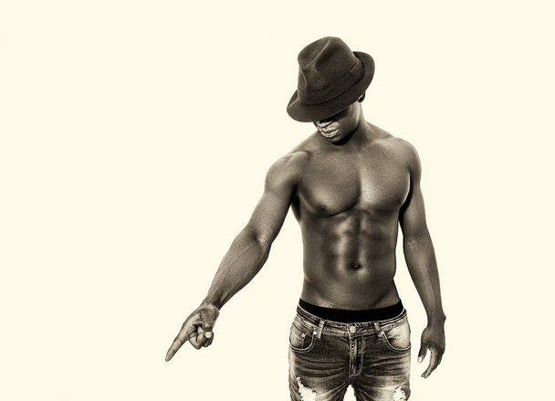 Bare-chested african man portrait pointing something - Foto, Imagem