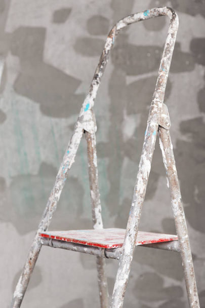 Old painted and stucco ladder on concrete wall - Fotografie, Obrázek