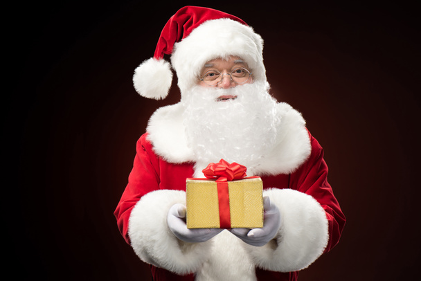 Santa Claus with gift box in hand - Φωτογραφία, εικόνα