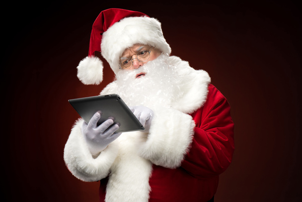 Santa Claus with digital tablet - Фото, зображення