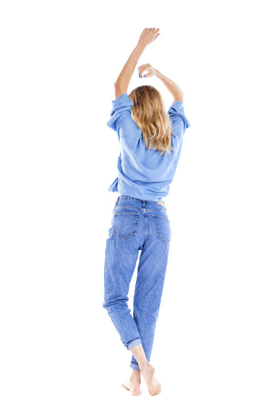 Young beautiful blonde woman in blue jeans  - Foto, imagen
