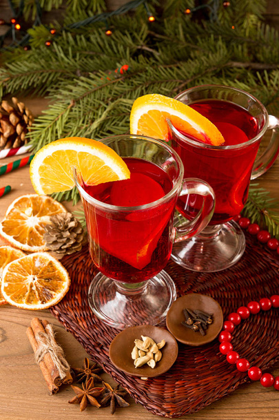 Two glasses of mulled wine over on wooden table. - Photo, Image