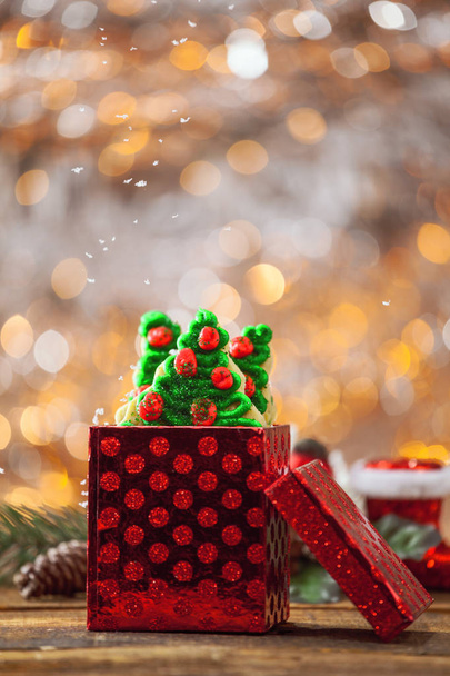 Christmas Tree Cookies In Red Holiday Gift Box With Snow Falling By Fire. - Foto, Imagem