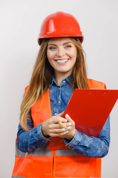 Woman engineer construction builder in helmet. - Fotó, kép