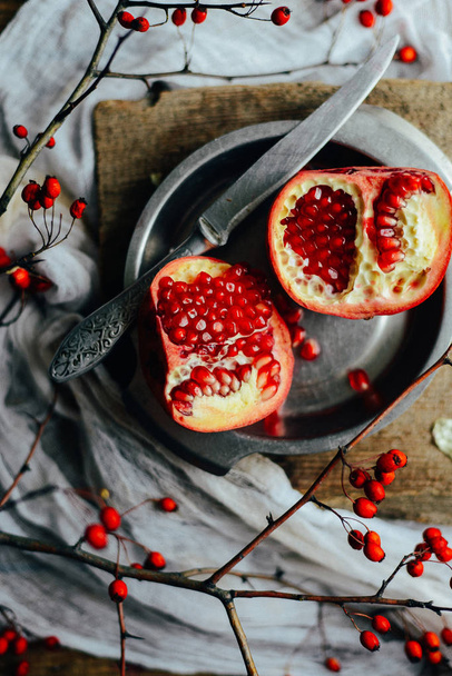 Fresh red pomegranate and grapefruit On a wooden background. Pom - Photo, Image