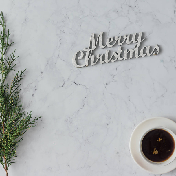 Merry Christmas inscription with coffee on cup  - Photo, Image