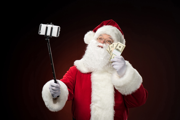 Santa Claus tomando selfie
  - Foto, imagen