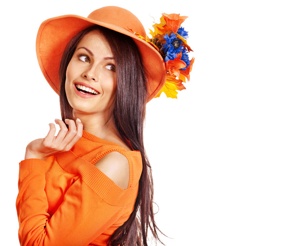 Happy woman wearing orange hat with flower. - Φωτογραφία, εικόνα