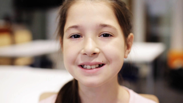 happy smiling beautiful preteen girl at school - Felvétel, videó