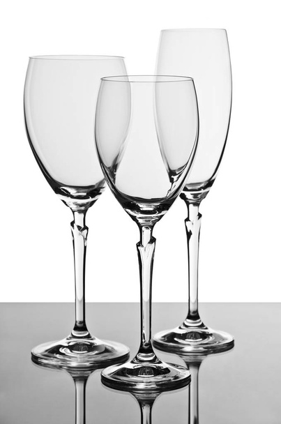 two glasses for wine and one for champagne empty - Foto, imagen
