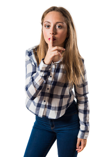 Blonde teen girl making silence gesture - Photo, Image