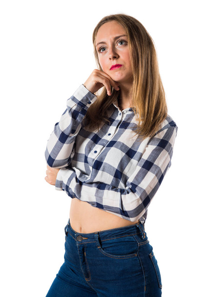 Blonde teen girl thinking - Фото, зображення