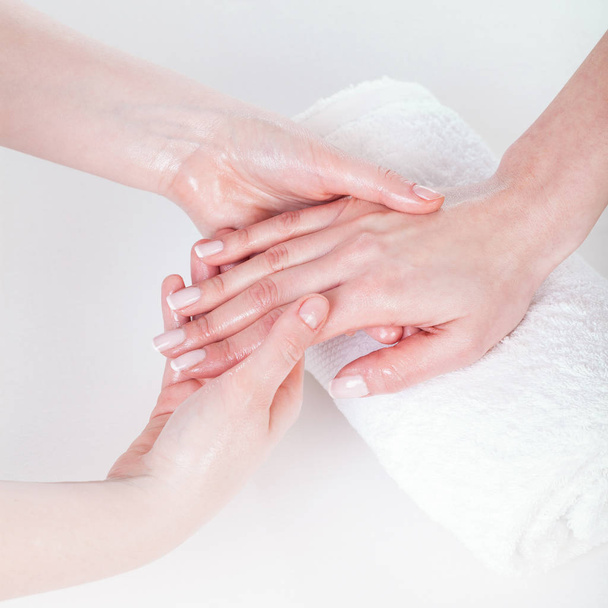 Woman having hand massage - 写真・画像