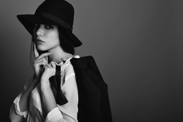 Beautiful woman in black hat - Zdjęcie, obraz