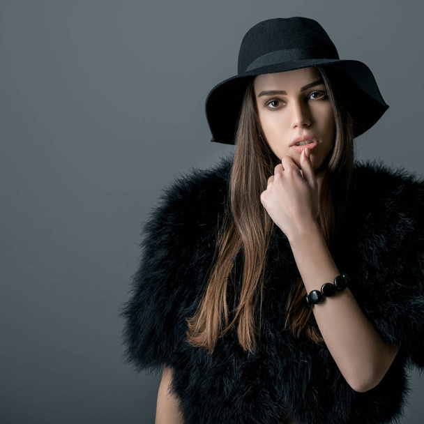 Beautiful woman in black hat - Valokuva, kuva