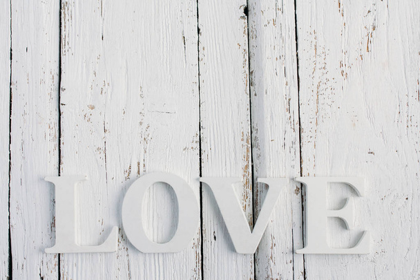 The word love on a white table - Foto, imagen