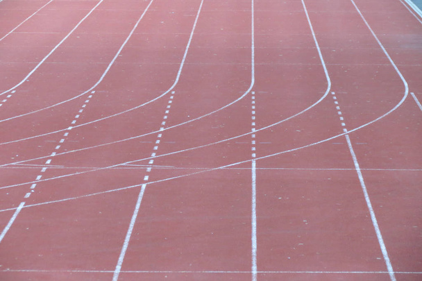 All-weather running track perspective useful as sport or competition concept - Photo, Image