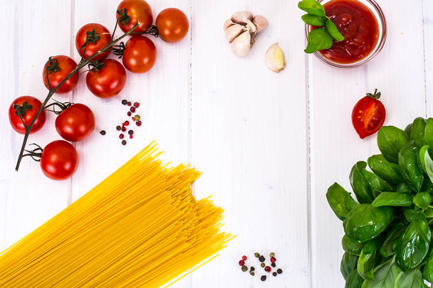 Basil, Red Cherry Tomato with Pasta on White Background - Foto, immagini