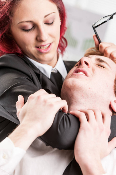 woman violently abusing of a man colleague - Foto, Bild