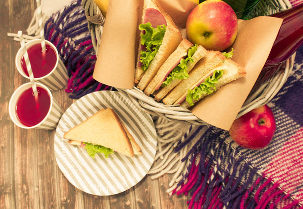 Food and things for a picnic on wooden background. - Foto, Imagem