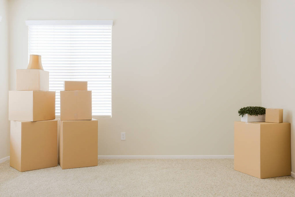 Variety of Packed Moving Boxes In Empty Room - Photo, Image