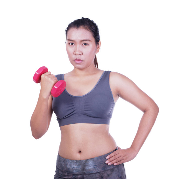 Beautiful fitness woman with lifting dumbbells  - Фото, зображення