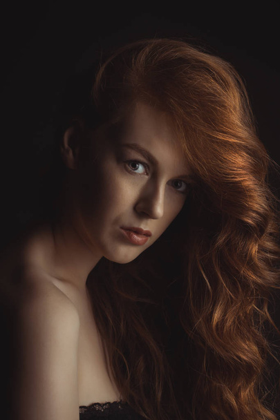 Closeup portrait of young beautiful model at studio - Фото, изображение