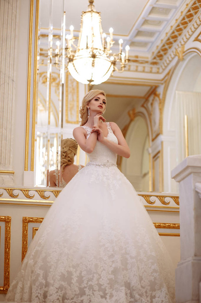 beautiful young woman bride in luxury wedding dress in interior - Valokuva, kuva