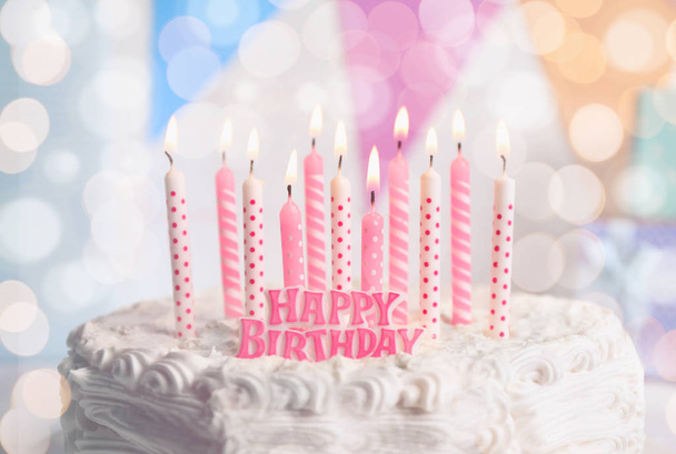 Lighted candles on birthday cake - Foto, Bild