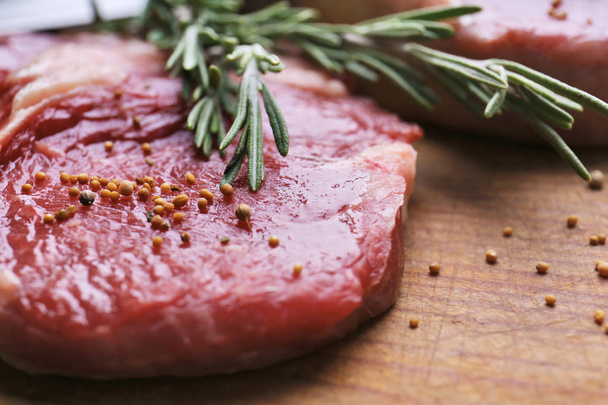 Delicious Raw steak with rosemary - Foto, imagen