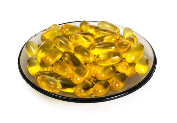 Omega3 Extra capsules uit visolie op witte achtergrond - Foto, afbeelding