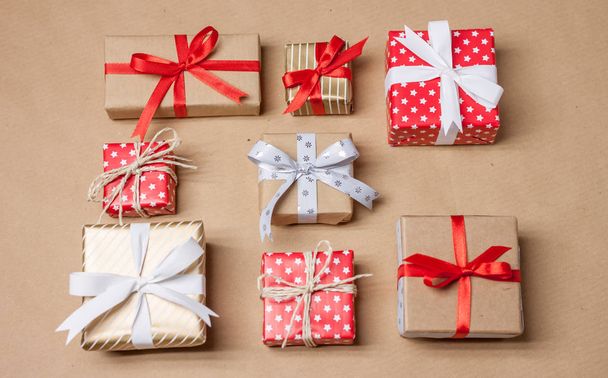 christmas presents laid on craft paper - Foto, Imagen