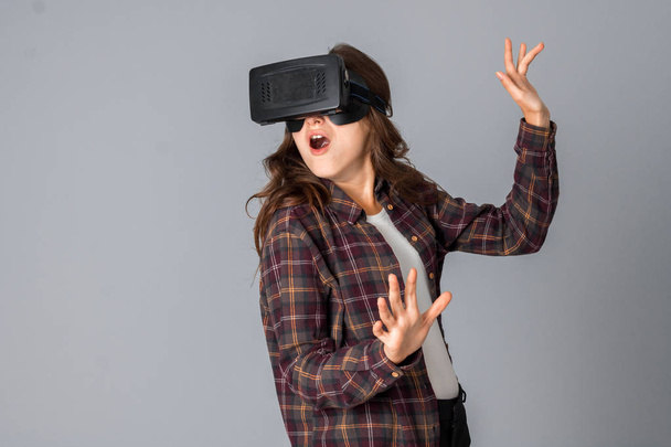 funny brunette woman testing virtual reality helmet - Φωτογραφία, εικόνα