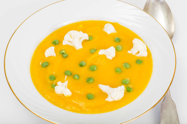 Pumpkin Puree Soup with Cauliflower and Green Peas - Photo, Image