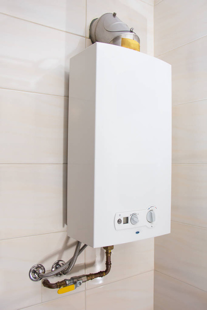 Home gas water heater - boiler in bathroom for hot water - Photo, Image