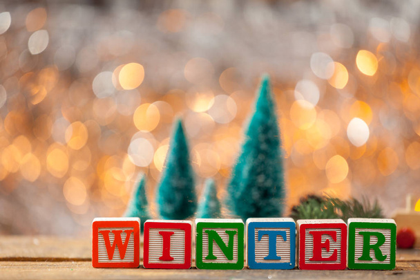 Winter Written With Toy Blocks On Christmas Card Background - Фото, изображение