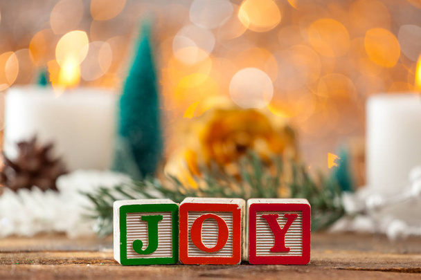 Joy Written With Toy Blocks On Christmas Card Background - Foto, afbeelding