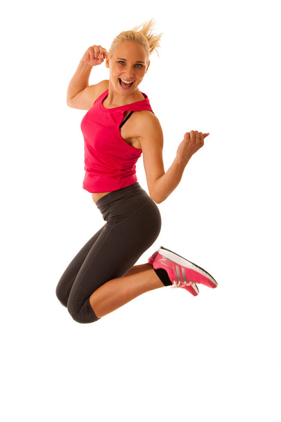 healthy lifestyle sport success - fit blond woman gesturing vict - 写真・画像