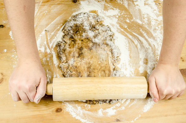 hands baking with rolling pin - Фото, изображение