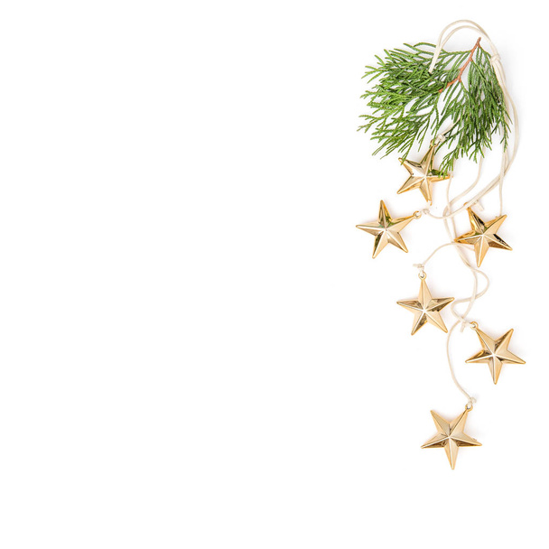 Golden stars evergreen branches Christmas ornaments minimal - Foto, afbeelding