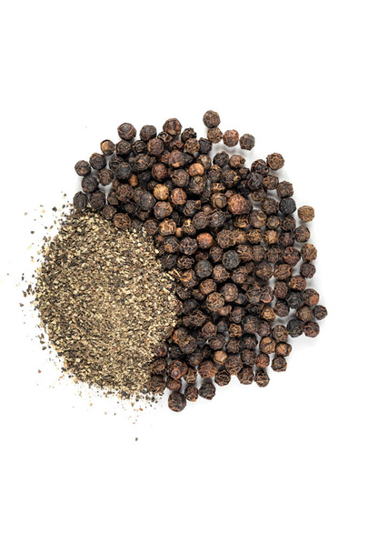 Black peppercorns and ground pepper - Photo, Image