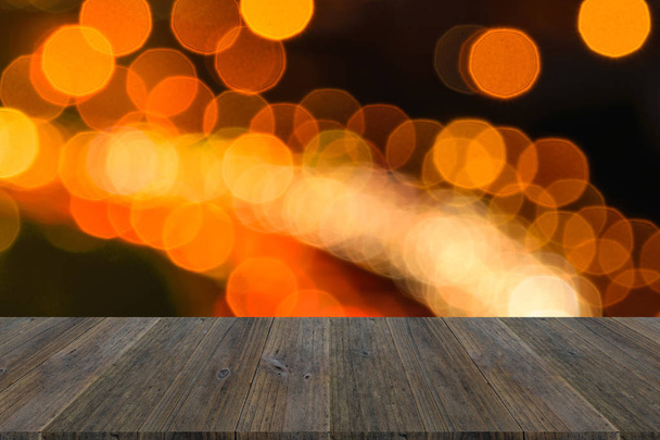 Luzes de bokeh desfocadas com terraço em madeira
 - Foto, Imagem