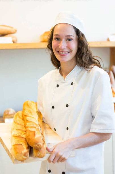 woman baker working at the bakery - Valokuva, kuva
