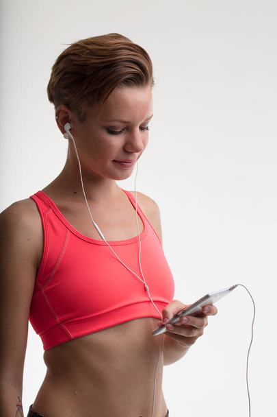 woman ready to workout with music - Photo, image