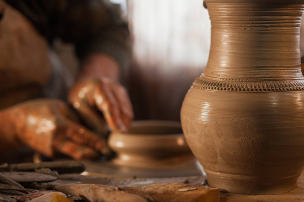 Potter working a piece of clay - Fotografie, Obrázek