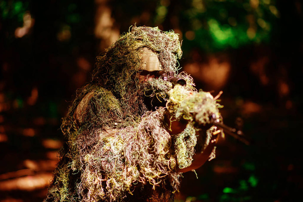 Sniper wears ghillie suit - Фото, изображение