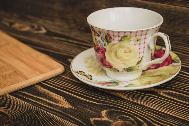 tea cup on brown wooden table - 写真・画像