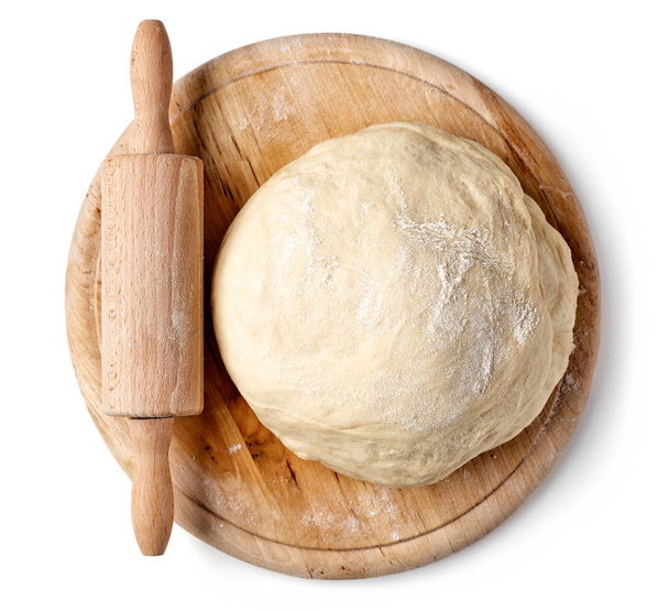 fresh raw dough on wooden board - Photo, Image